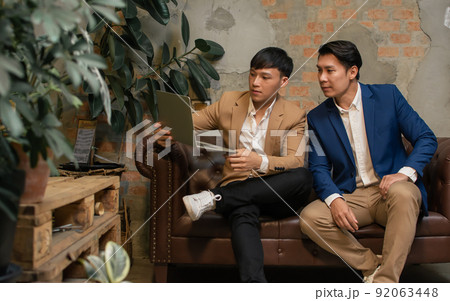 Two business men talking and planning their jobs Two business men talking and planning their jobs 92063448