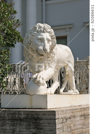 ancient lion sculpture made of stone. vertical shot of lion statue, travel in Europe, classic architecture and odl buildings sightseeing. ancient lion sculpture made of stone. vertical shot of lion statue, travel in Europe, classic architecture and odl buildings sightseeing. 92066631