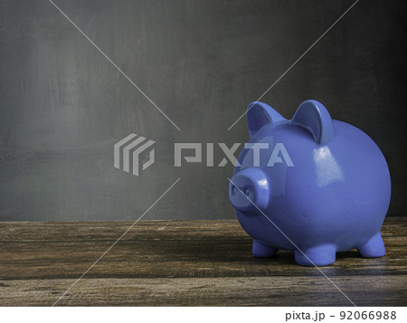 blue piggy on wood table for earn or saving concept blue piggy on wood table for earn or saving concept 92066988