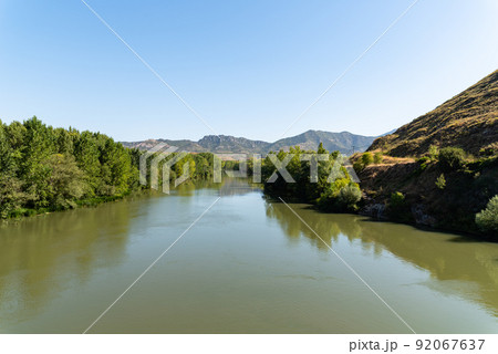 Ebro River in Haro, La Rioja, sunny day of summer Ebro River in Haro, La Rioja, sunny day of summer 92067637