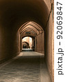 An adobe arch paved with rough stone in the ancient adobe city of Yazd. 92069847