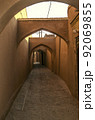 Narrow labyrinths of the ancient adobe city of Yazd with arched passages and roads paved with rough stone. 92069855