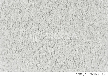 White wall with plaster background. Plaster and putty grain surface texture. Finishing, decor concept. White wall with plaster background. Plaster and putty grain surface texture. Finishing, decor concept. 92072045
