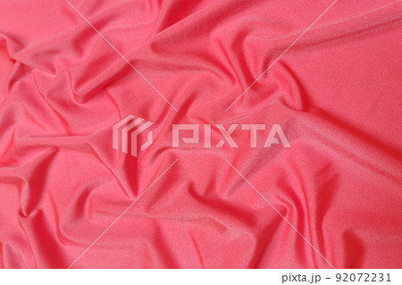 Pink supplex crumpled or wavy fabric texture background. Abstract linen cloth soft waves. Silk fabric. Smooth elegant luxury cloth texture. Concept for banner or advertisement. 92072231