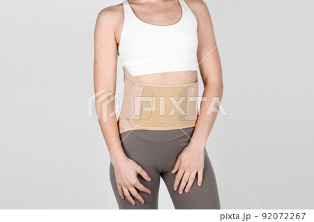 Foto de Orthopedic lumbar corset on the human body. Back brace