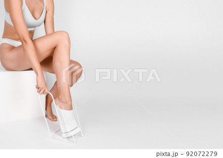 Anti-embolic Compression Hosiery for surgery isolated on white. Medical white stockings, tights for varicose veins and venouse therapy. Thrombo embolic deterrent hose or anti-embolism stockings. Anti-embolic Compression Hosiery for surgery isolated on white. Medical white stockings, tights for varicose veins and venouse therapy. Thrombo embolic deterrent hose or anti-embolism stockings. 92072279