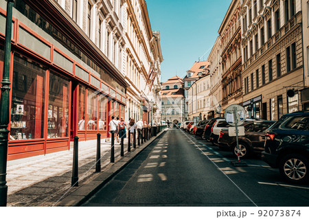 Beautiful cozy narrow street in old european city of Prague. Amazing architecture, historical Beautiful cozy narrow street in old european city of Prague. Amazing architecture, historical 92073874