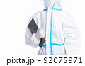 girl in a protective suit on a white background 92075971