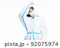 girl in a protective suit on a white background 92075974