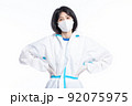 girl in a protective suit on a white background 92075975