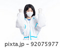 girl in a protective suit on a white background 92075977