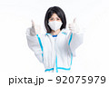 girl in a protective suit on a white background 92075979