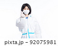 girl in a protective suit on a white background 92075981