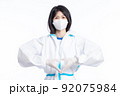 girl in a protective suit on a white background 92075984