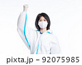 girl in a protective suit on a white background 92075985