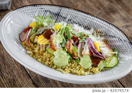 Closeup on gourmet bowl of unagi eel and couscous Closeup on gourmet bowl of unagi eel and couscous 92076574