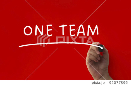 One team text on red cover background. Teamwork concept One team text on red cover background. Teamwork concept 92077396