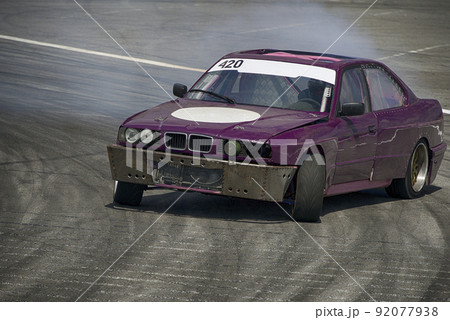 Unknown rider on the car overcomes the track. Unknown rider on the car overcomes the track. 92077938