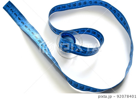 A rag meter of a seamstress lies on a white background. A rag meter of a seamstress lies on a white background. 92078401