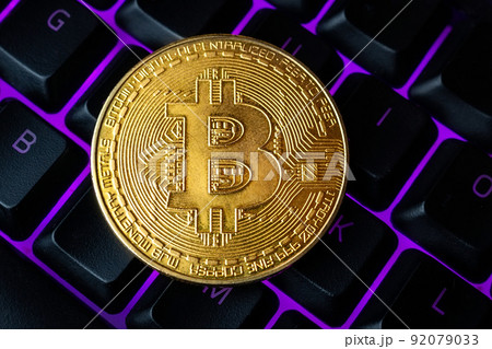 gold bitcoin on the keyboard 92079033