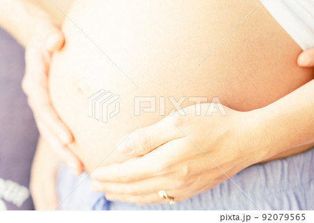 Pregnant woman belly hands. Happy pregnancy woman and husband hugging pregnant belly. Concept maternity, pregnancy, childbirth. Pregnant woman belly hands. Happy pregnancy woman and husband hugging pregnant belly. Concept maternity, pregnancy, childbirth. 92079565