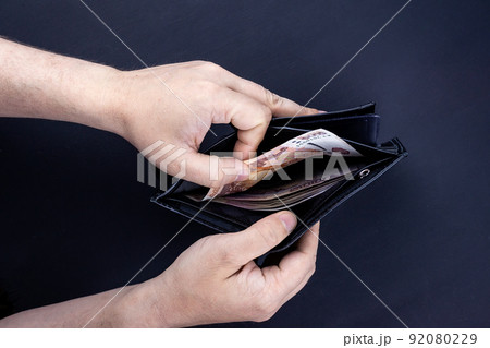 wallet with money in hand 92080229