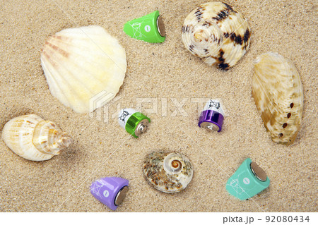 image of battery seashell sand background 92080434