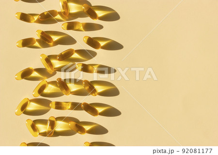 Set of shadowed Omega 3, Omega 6 and Omega 9 capsules on beige background, flat lay, copy space, horizontal.	 92081177