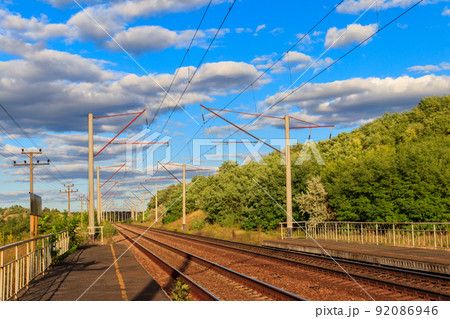 Scenic railroad in rural area and blue sky with white clouds at summer Scenic railroad in rural area and blue sky with white clouds at summer 92086946