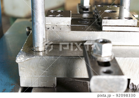 Automation hydraulic press stamping machine production line. industrial metalworking machines. Close-up of a hydraulic press in an industrial workshop at a factory. 92098330