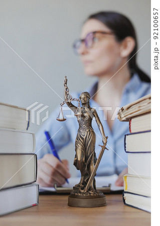 female lawyer works in the office, checking the contract and preparing documents for the court. legal advice online female lawyer works in the office, checking the contract and preparing documents for the court. legal advice online 92100657