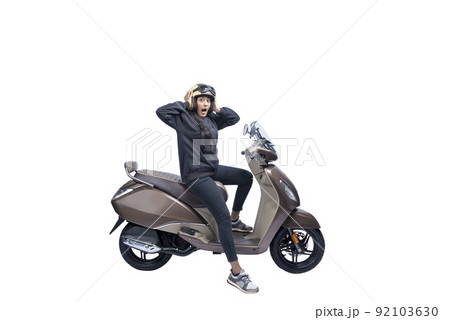 Asian woman with a helmet and jacket sitting on a scooter with a shocked expression Asian woman with a helmet and jacket sitting on a scooter with a shocked expression 92103630