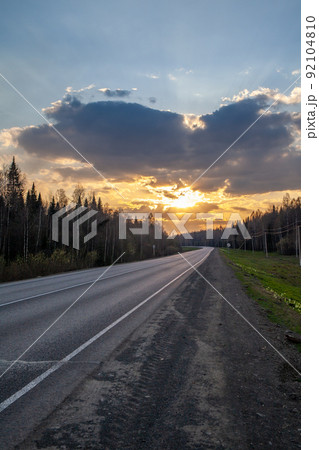 Country road with markings in the middle of the forest. Country road with markings in the middle of the forest. 92104810