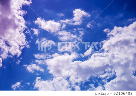 Beautiful sky. White clouds in the blue summer sky. Swallows or swifts flying against the clouds. The majesty and beauty of nature. Natural background with copy space for text and design elements. Beautiful sky. White clouds in the blue summer sky. Swallows or swifts flying against the clouds. The majesty and beauty of nature. Natural background with copy space for text and design elements. 92106408