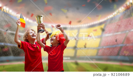 Belgium football fan. Belgian kids play soccer. 92106689