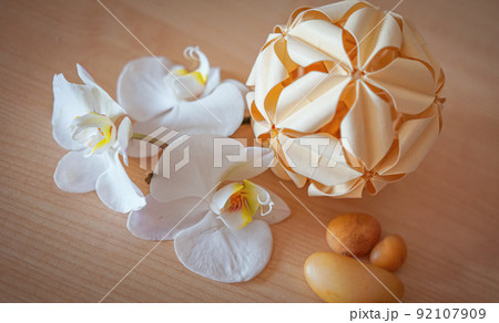 large white orchid flowers on a brown background 92107909
