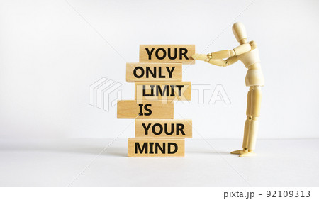 Your only limit is your mind symbol. Wooden blocks with words 'Your only limit is your mind'. Businessman model. Beautiful white background. Business, popular quotation concept. Copy space. 92109313