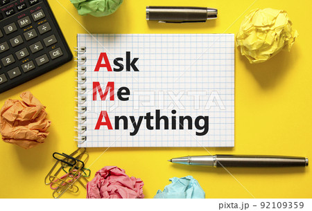 AMA ask me anything symbol. Concept words AMA ask me anything on white note on a beautiful yellow background. Calculator and pen. Business and AMA ask me anything concept. Copy space. 92109359