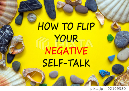Flip negative self-talk symbol. Concept words How to flip your negative self-talk on beautiful yellow background. Sea stones and seashells. Psychological flip negative self-talk concept. Copy space. Flip negative self-talk symbol. Concept words How to flip your negative self-talk on beautiful yellow background. Sea stones and seashells. Psychological flip negative self-talk concept. Copy space. 92109380