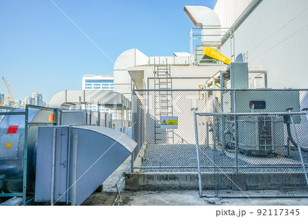 The industrial machine at the rooftop of the huge building. 92117345