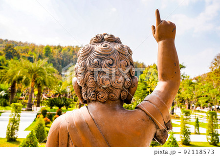 Little Buddha Bronze Copper statue points finger to the sky. Little Buddha Bronze Copper statue points finger to the sky. 92118573