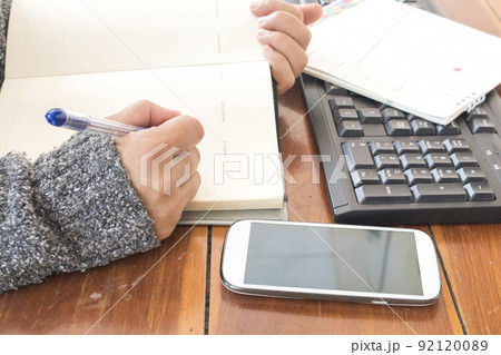 notebook planner with working woman for business work  92120089