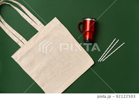 Textile shopping bag and coffee cup flat lay 92122503