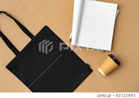 Textile shopping bag and coffee cup flat lay Textile shopping bag and coffee cup flat lay 92122665
