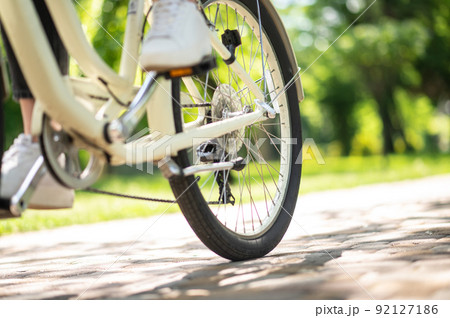 Close up of picture with a person on bike 92127186