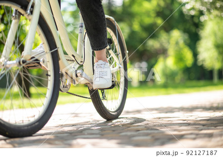Close up of picture with a person on bike 92127187