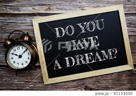 Do You Have A Dream? word with alarm clock on wooden background Do You Have A Dream? word with alarm clock on wooden background 92133000