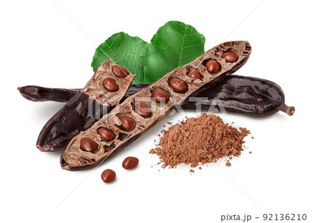 Carob pod and powder isolated on white background with full depth of field. Carob pod and powder isolated on white background with full depth of field. 92136210