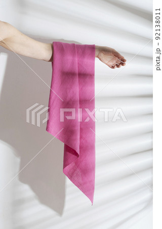 pink linen fabric on the woman hand pink linen fabric on the woman hand 92138011