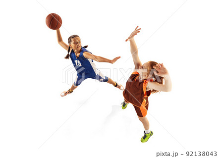 Aerial view of female basketball players, young girls, teen playing basketball isolated on white background. Concept of sport, team, enegry, competition, skills 92138043